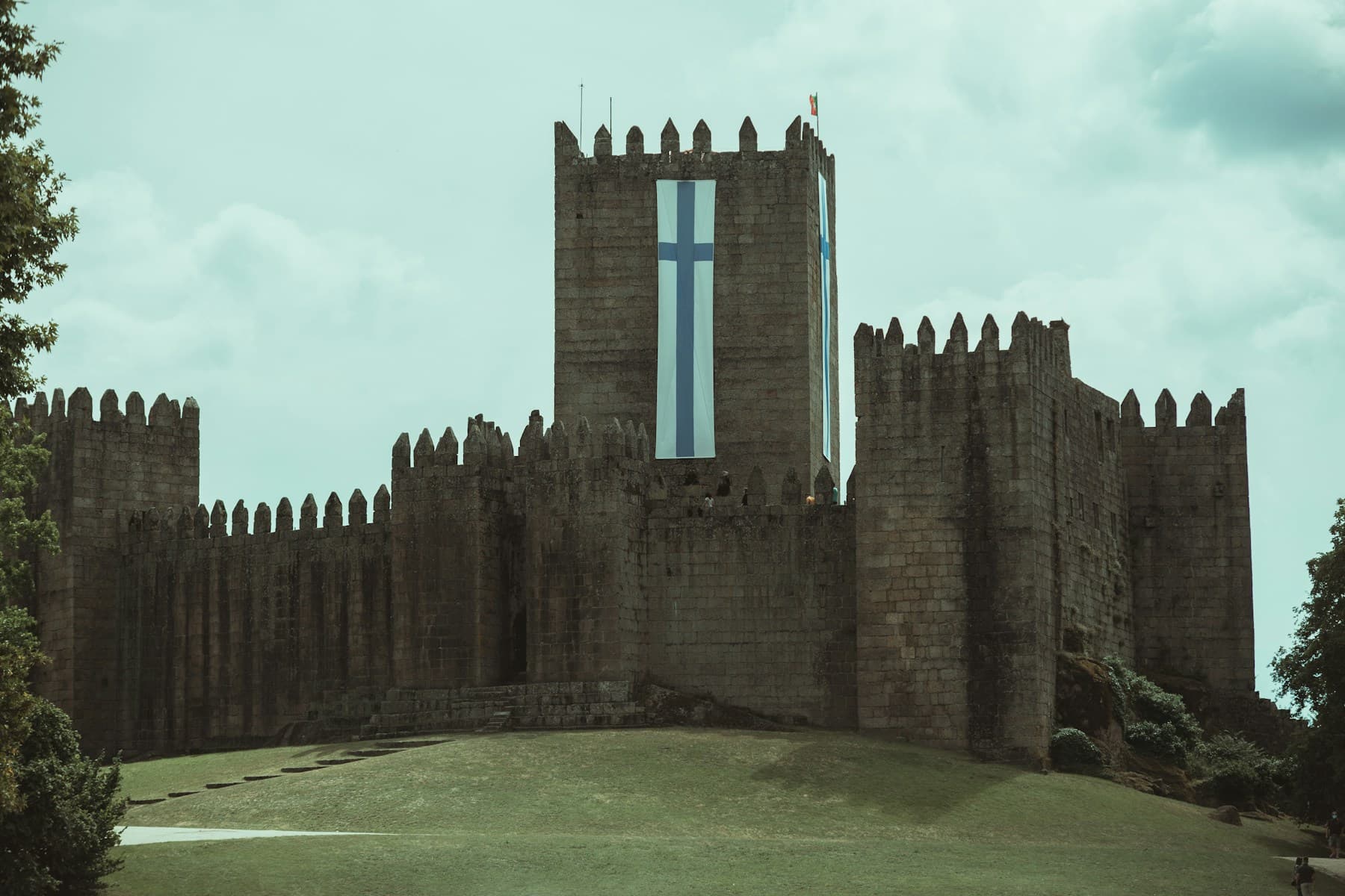Guimarães Castle beneath a cloudy sky