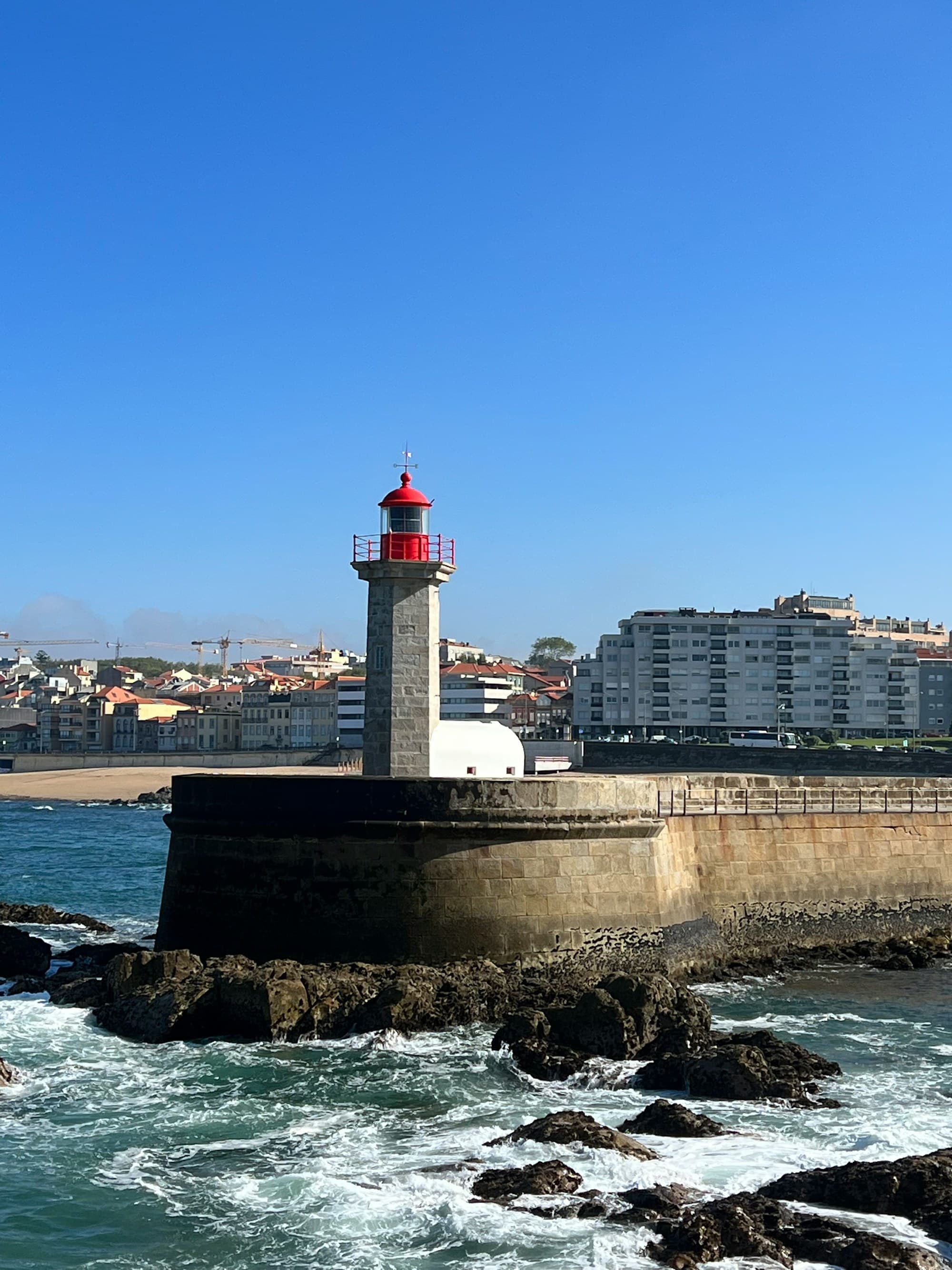 Rocky Atlantic coast and lighthouse in Foz do Douro