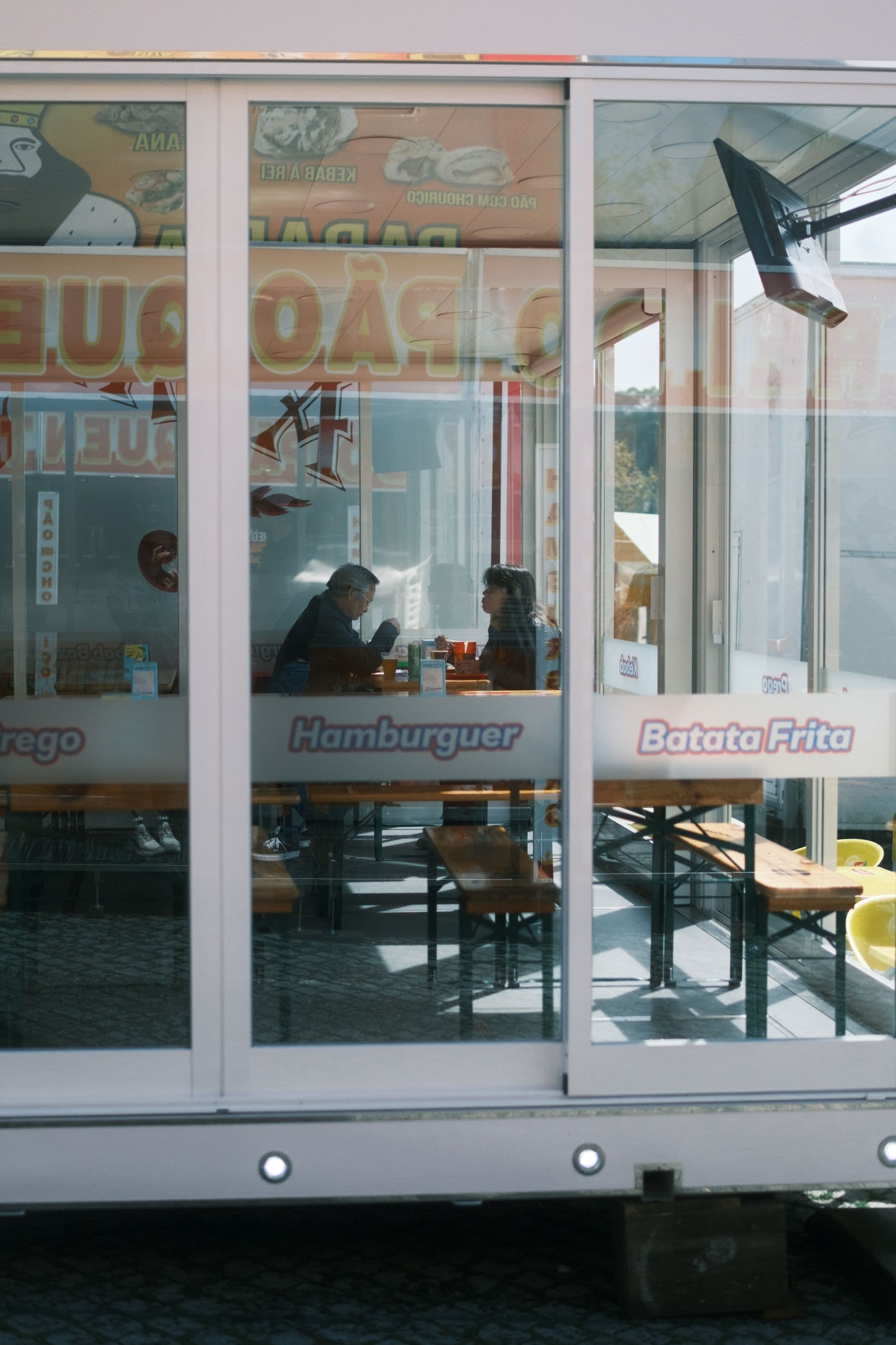 People eating inside a casual restaurant in Porto District