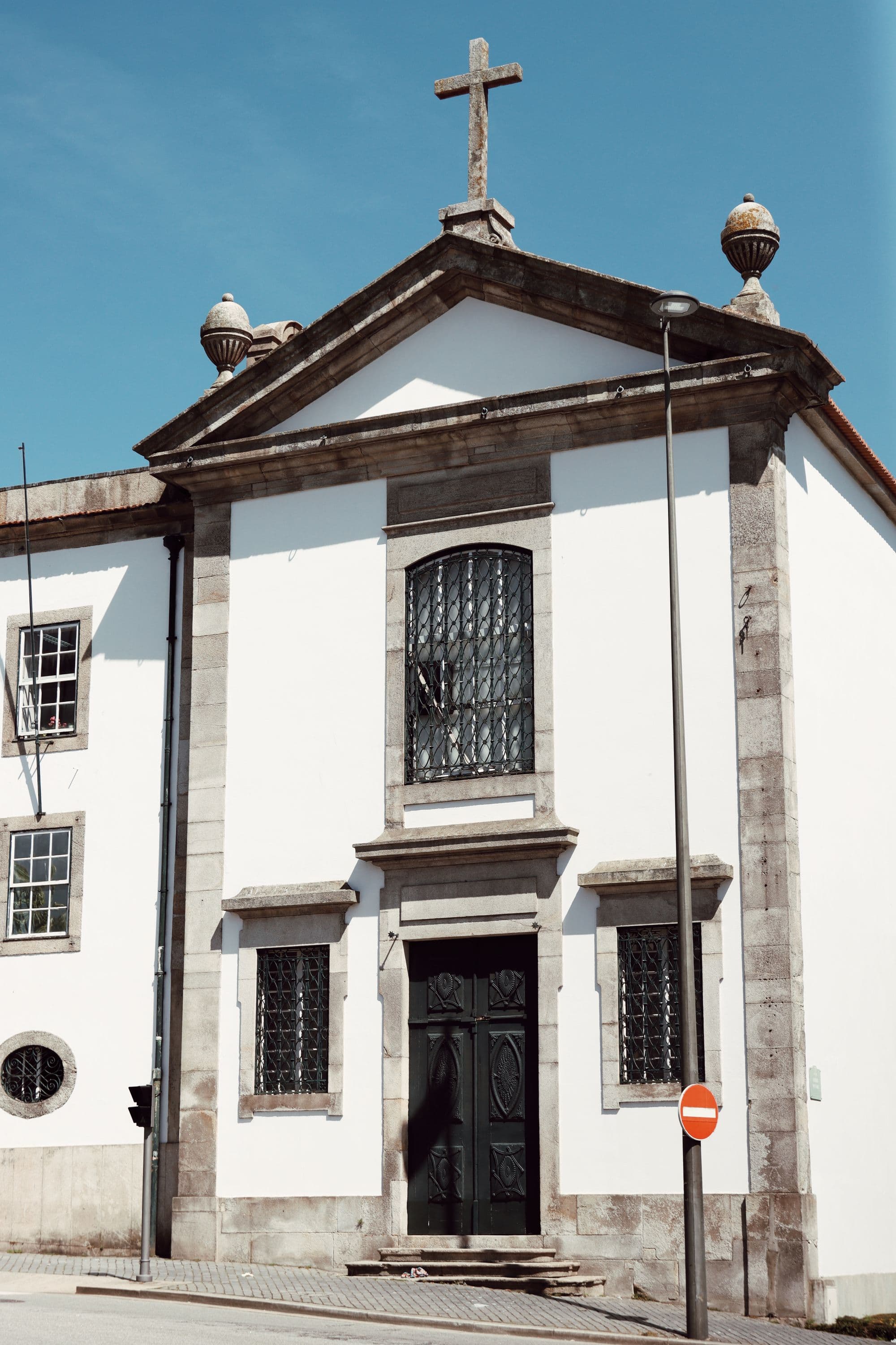 Small historic church façade on a Porto neighbourhood street