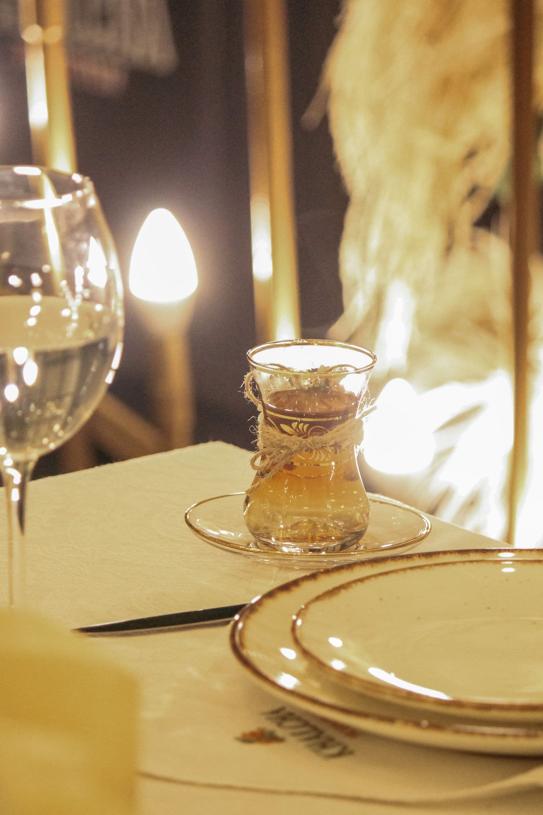 Candlelit restaurant table in a warm, intimate dining room