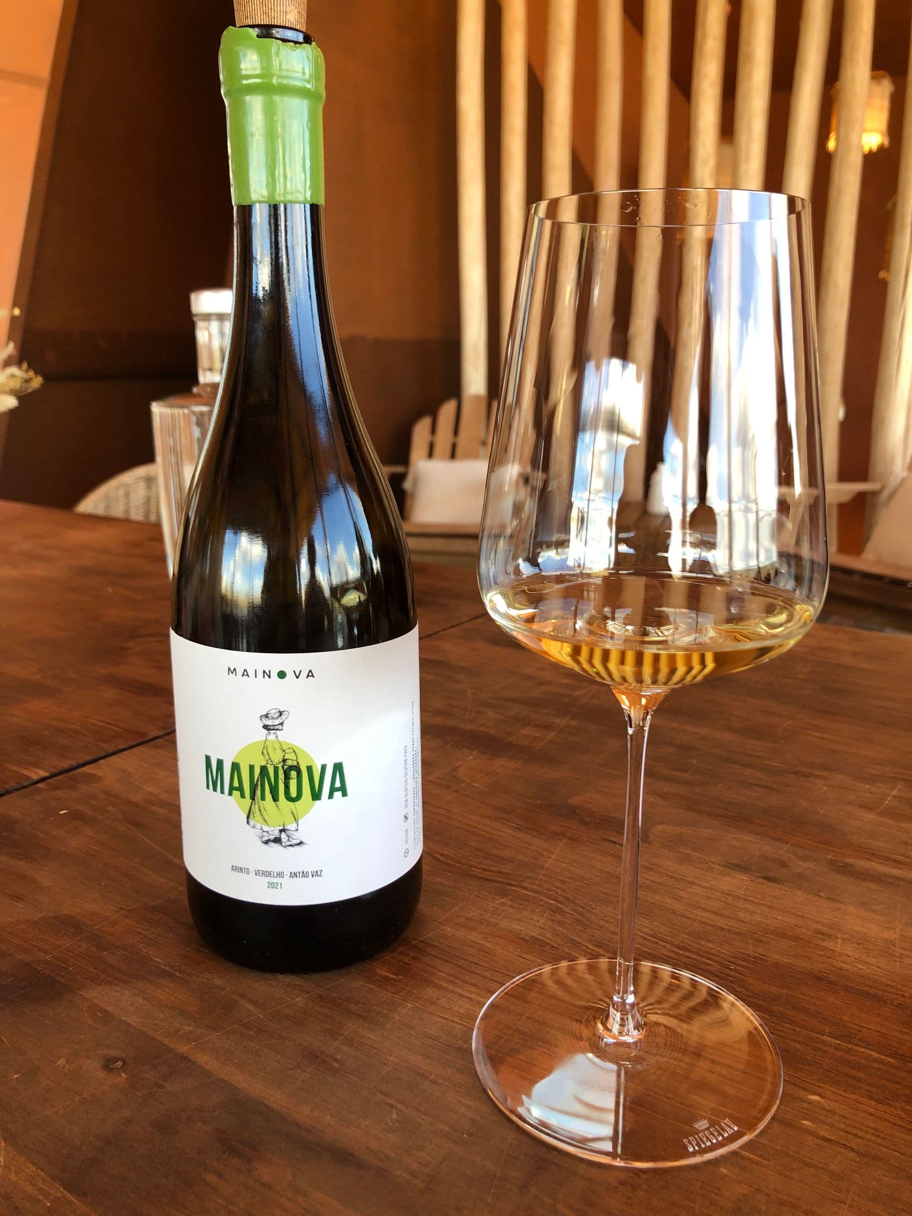 Bottle and wine glass on a wooden table