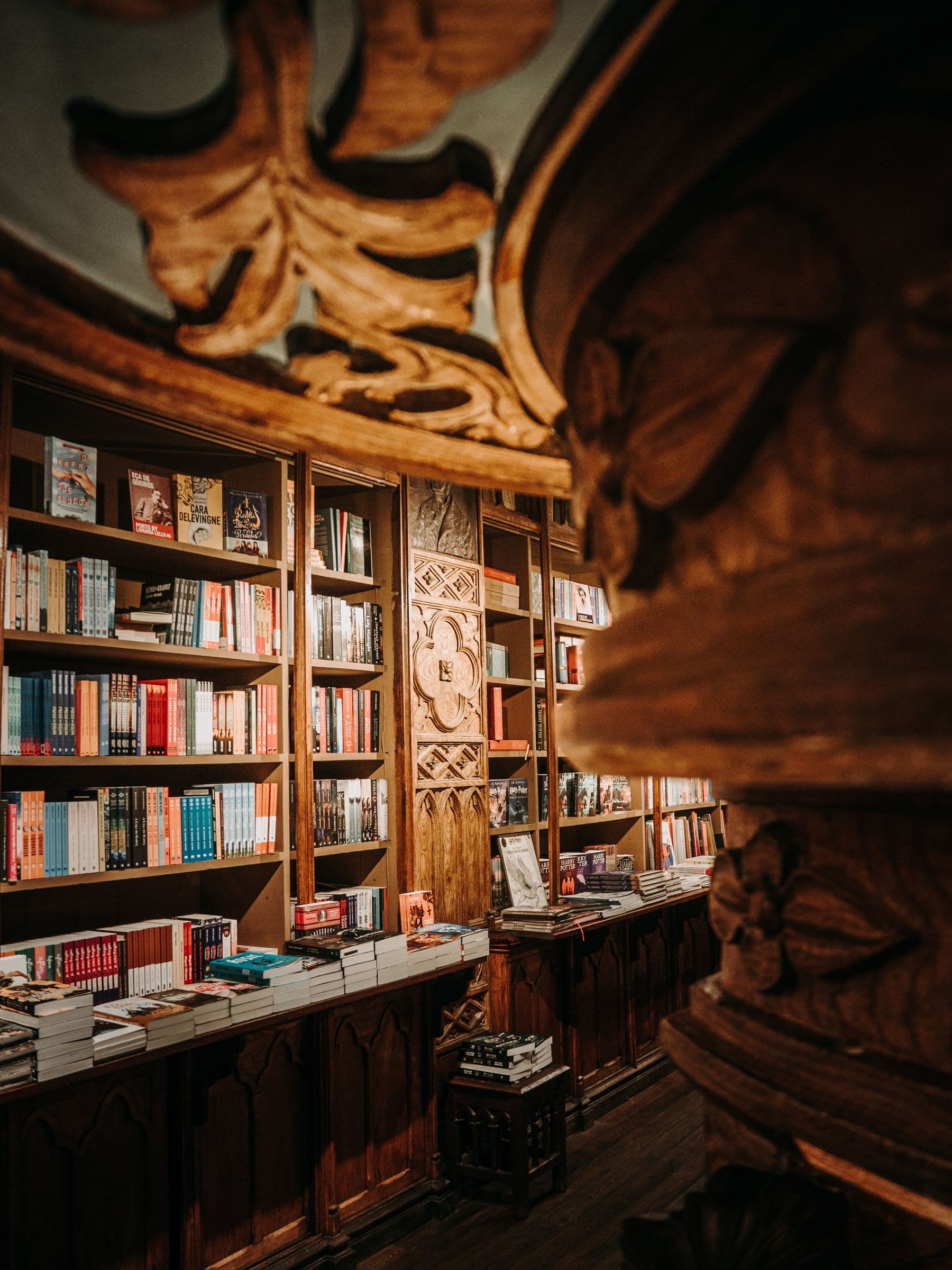 A visitor browsing inside a grand historic bookstore
