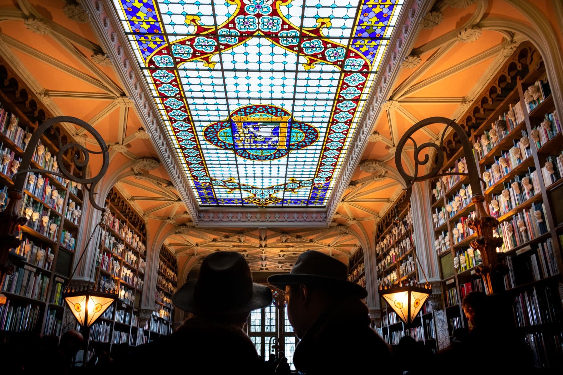 The stained glass ceiling inside Livraria Lello