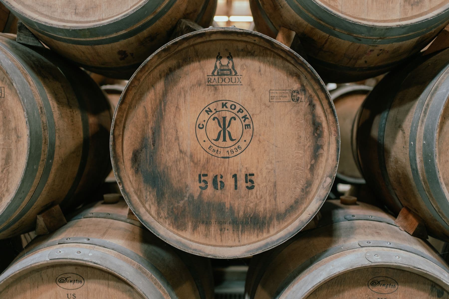 Wooden barrels ageing Port wine in a Porto cellar