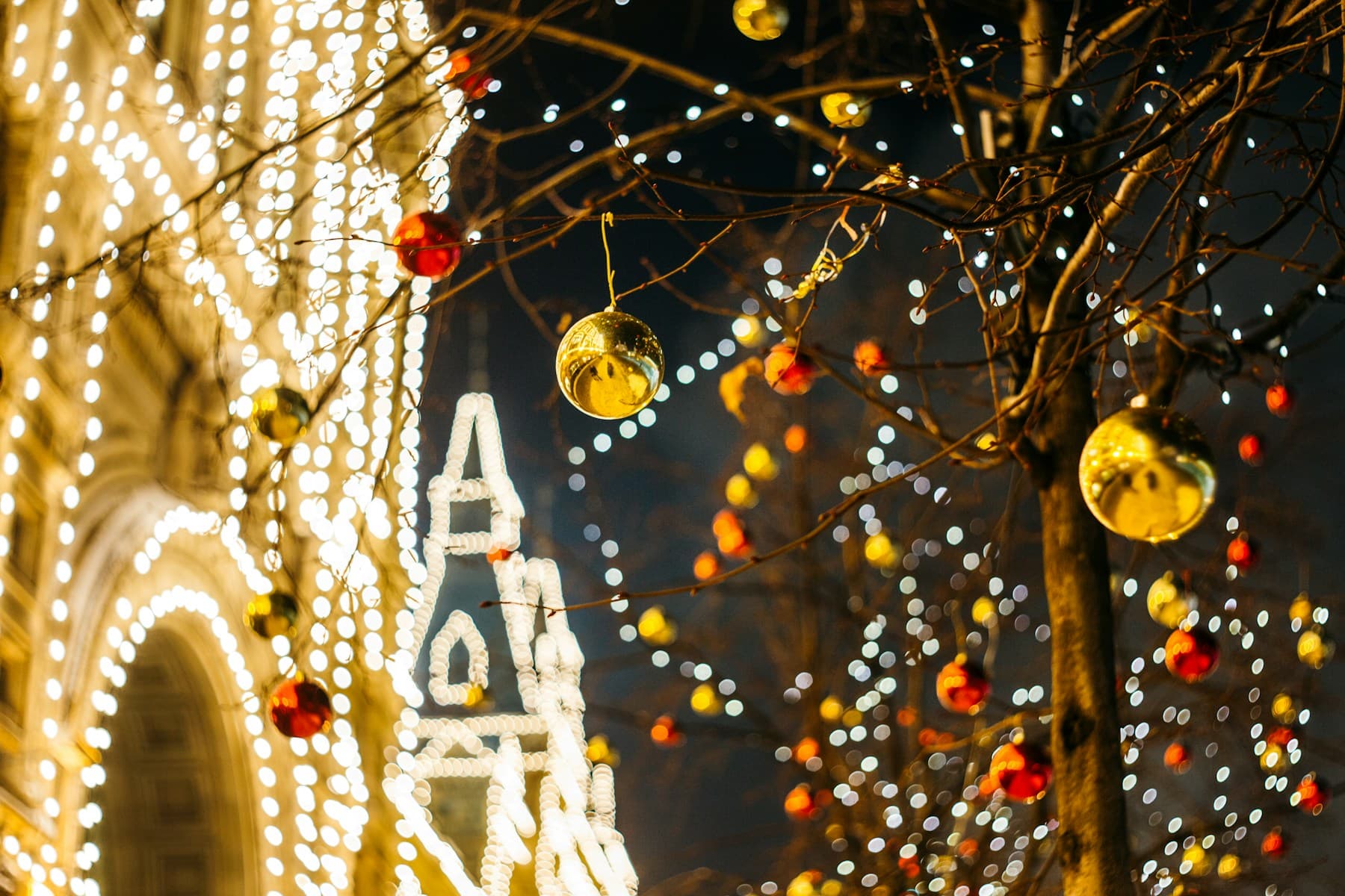Golden Christmas decorations and lights filling a city street