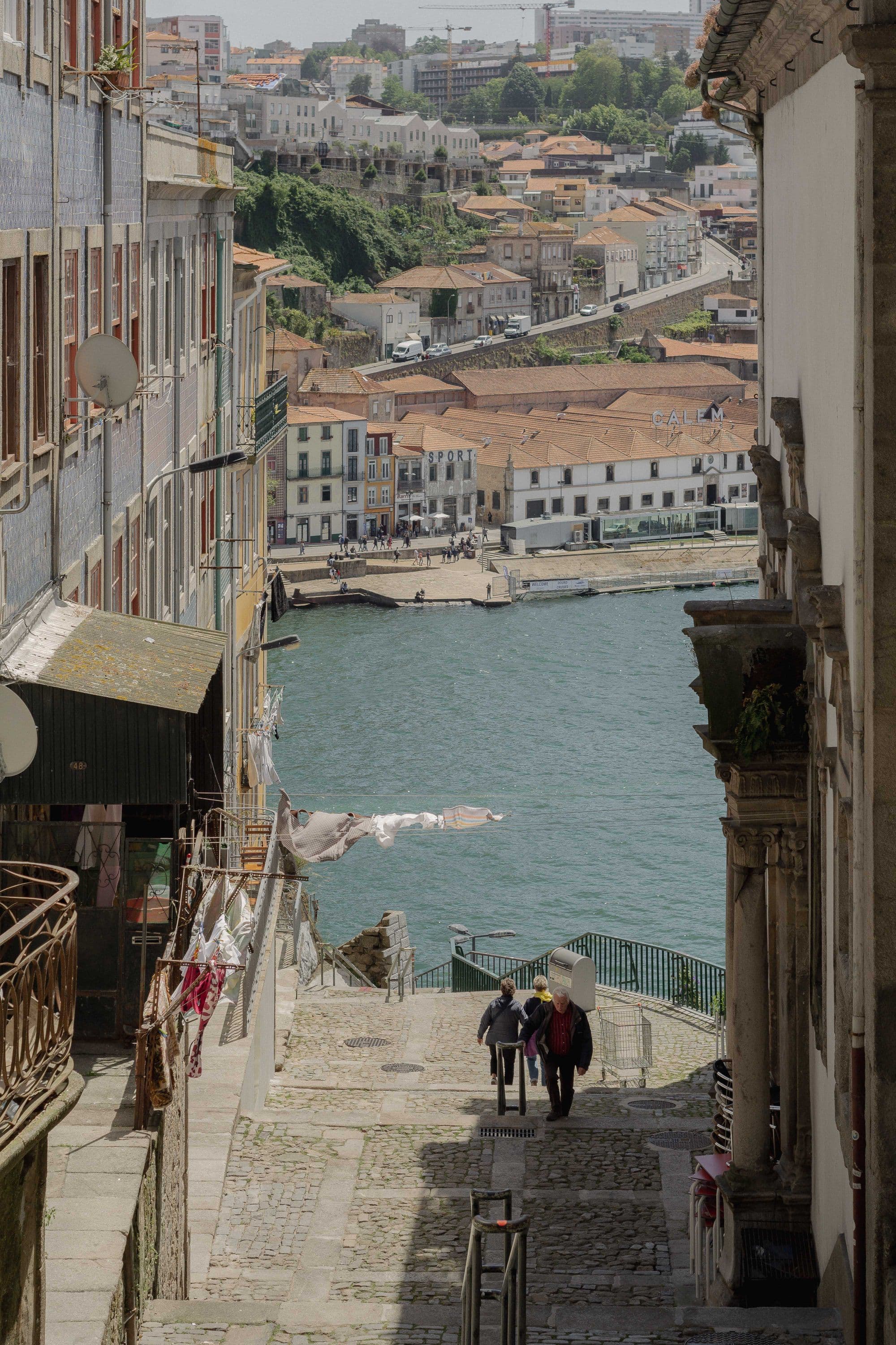 A steep Porto street descending towards the Douro and Gaia