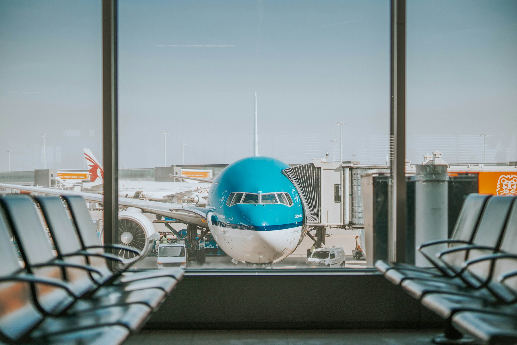 Travellers inside a modern airport terminal